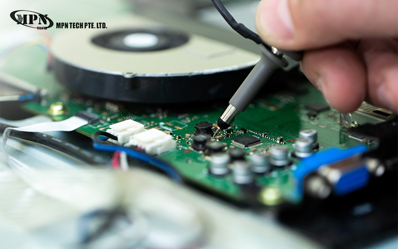 Technician testing an MPN Tech prototype circuit board assembly.