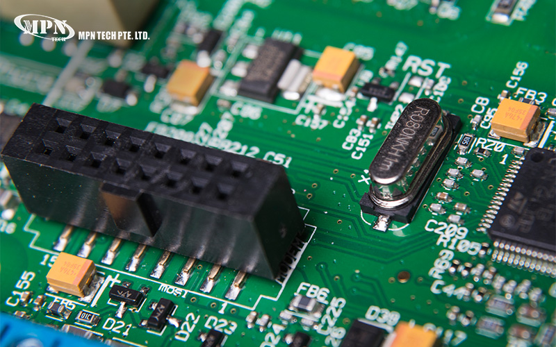 Detailed close-up of a green printed circuit board