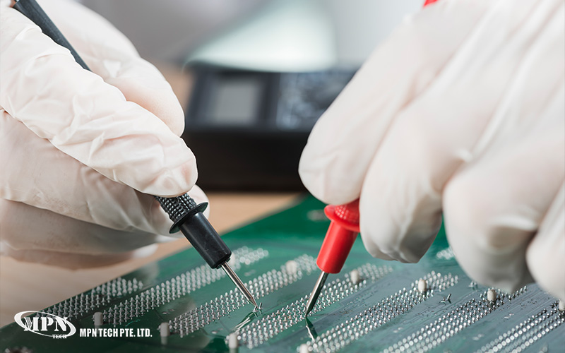 Close-up of a technician in white gloves using precision probes to test PCB circuits.