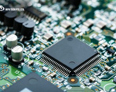 Close-up of circuit board components undergoing PCB quality control.