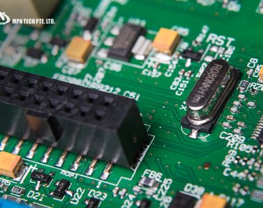 Detailed close-up of a green printed circuit board