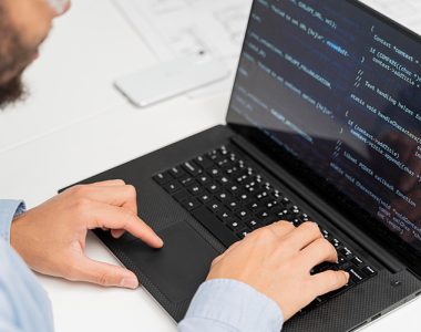 engineer working on code for electronics manufacturing